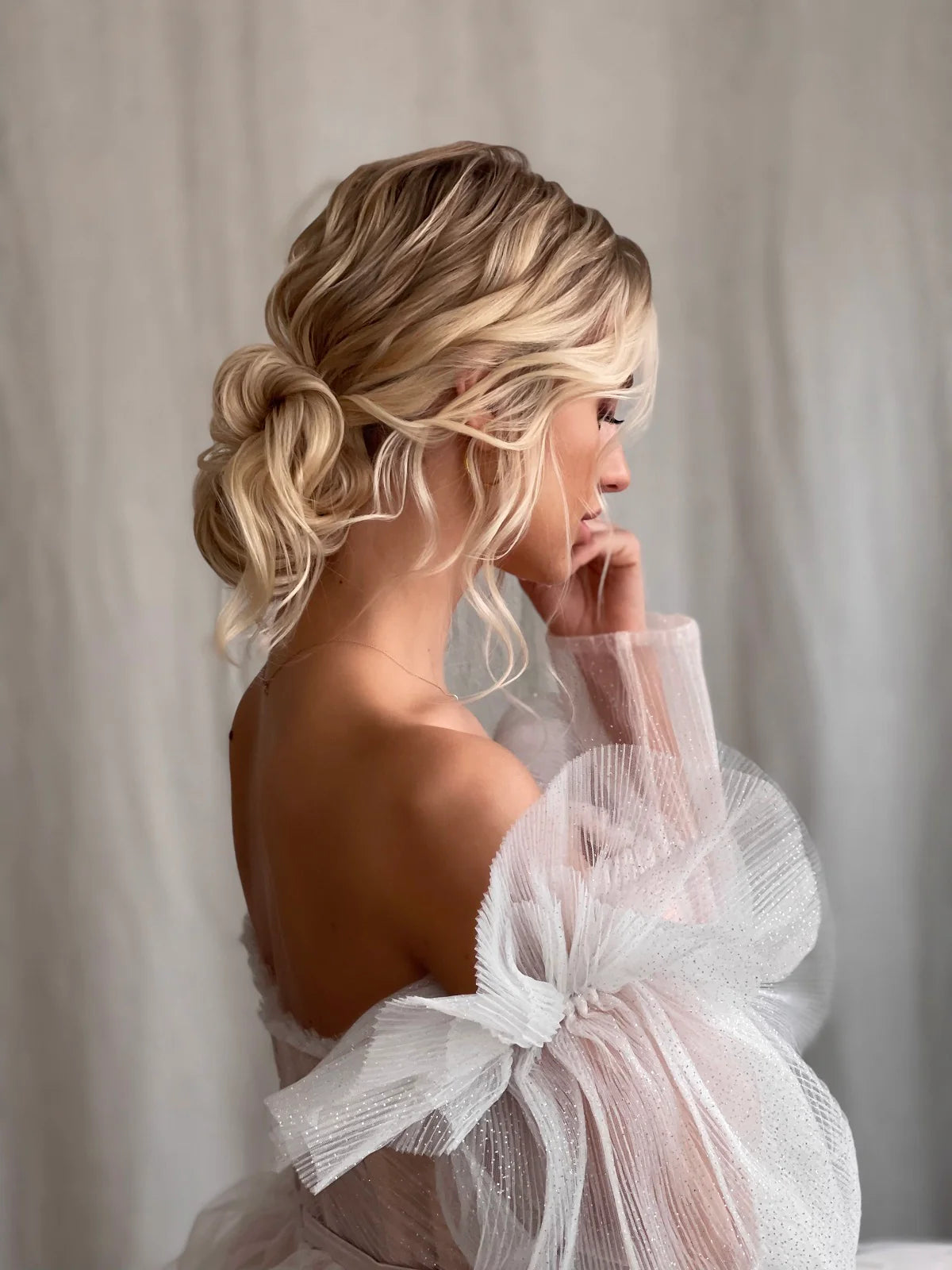 Bride with an updo in a tulle dress